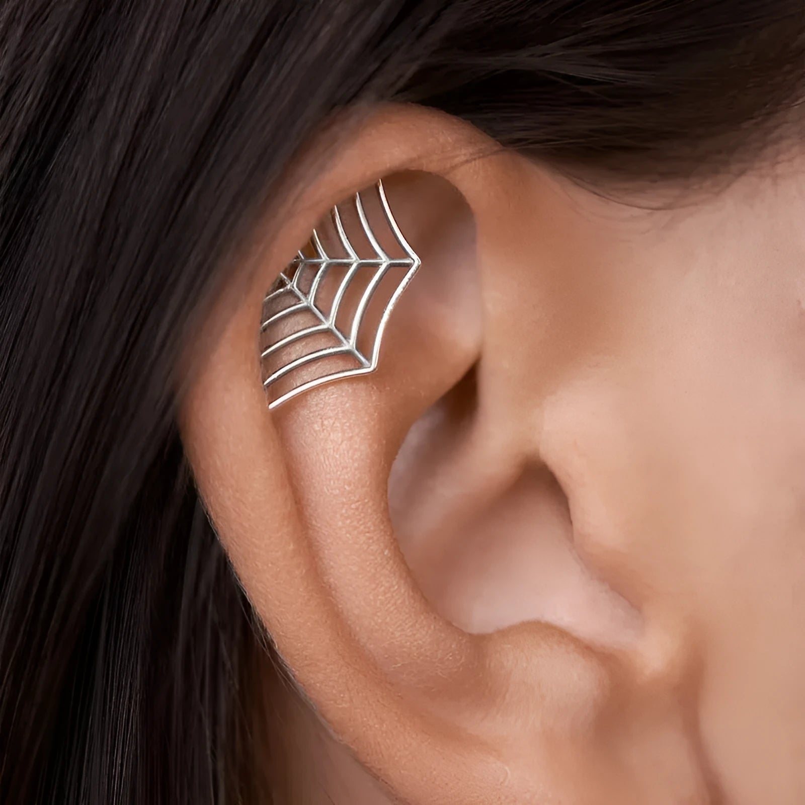 Geometric spider web stud earrings in gold and silver electroplated metal finishes