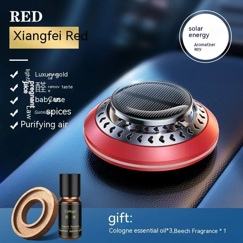 Solar-powered aluminium alloy car air freshener diffuser in black colour on a car dashboard.
