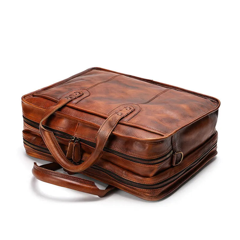 Men's black leather briefcase showing interior organisational pockets and compartments