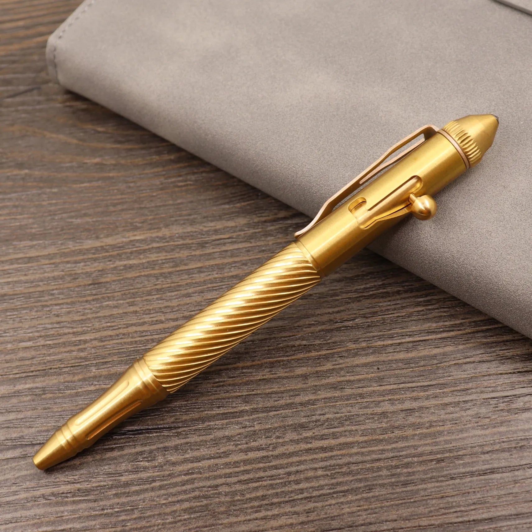 Retro brass tactical pen with bolt action mechanism in brushed natural finish