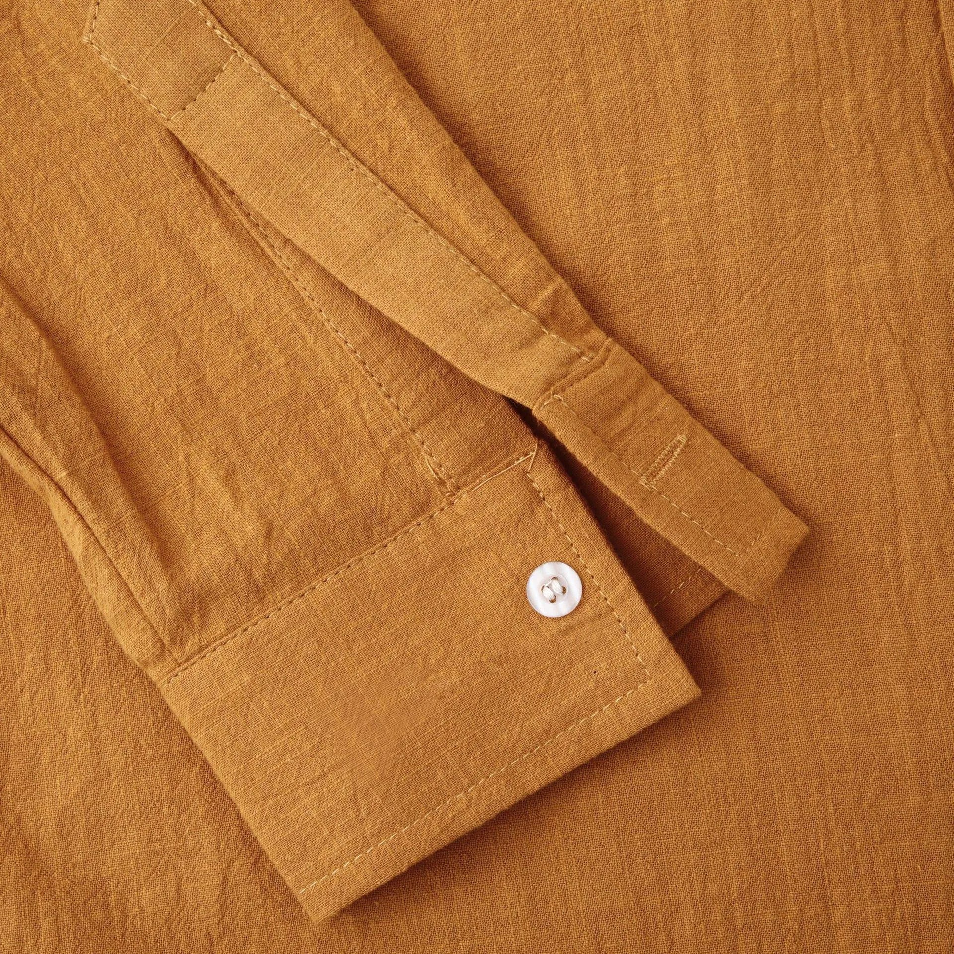 Men's slim fit brown cotton blend long sleeve shirt and pants casual set laid flat.