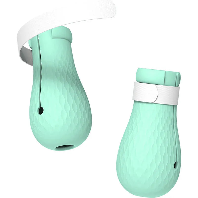 Four green silicone anti-scratch gloves designed to cover a cat's paws.