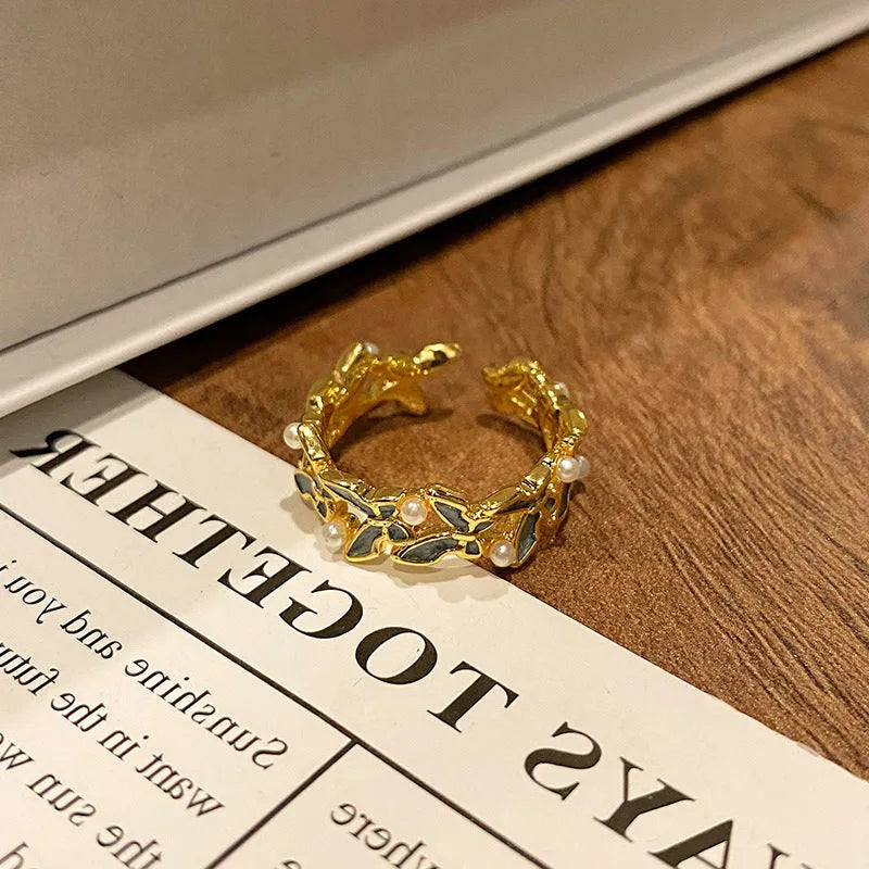 Women's copper butterfly ring with dripping oil finish and adjustable open loop design