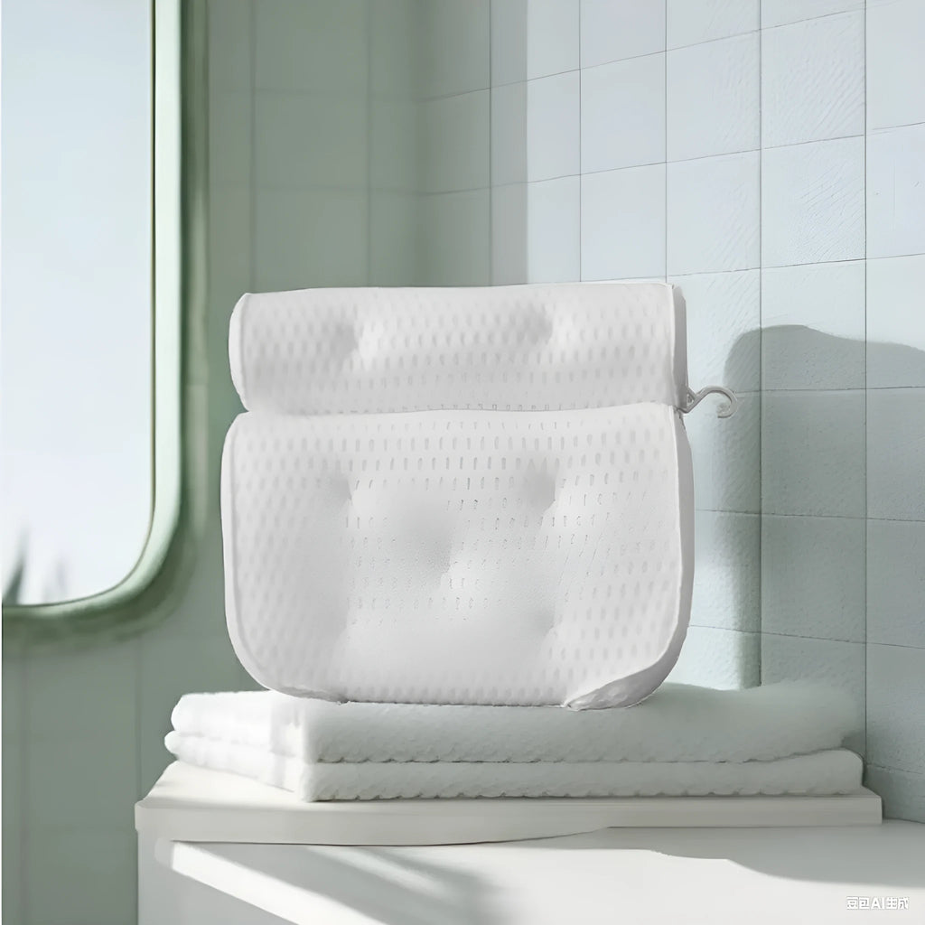 White bathtub pillow with 4D mesh fabric and suction cups on a flat surface.