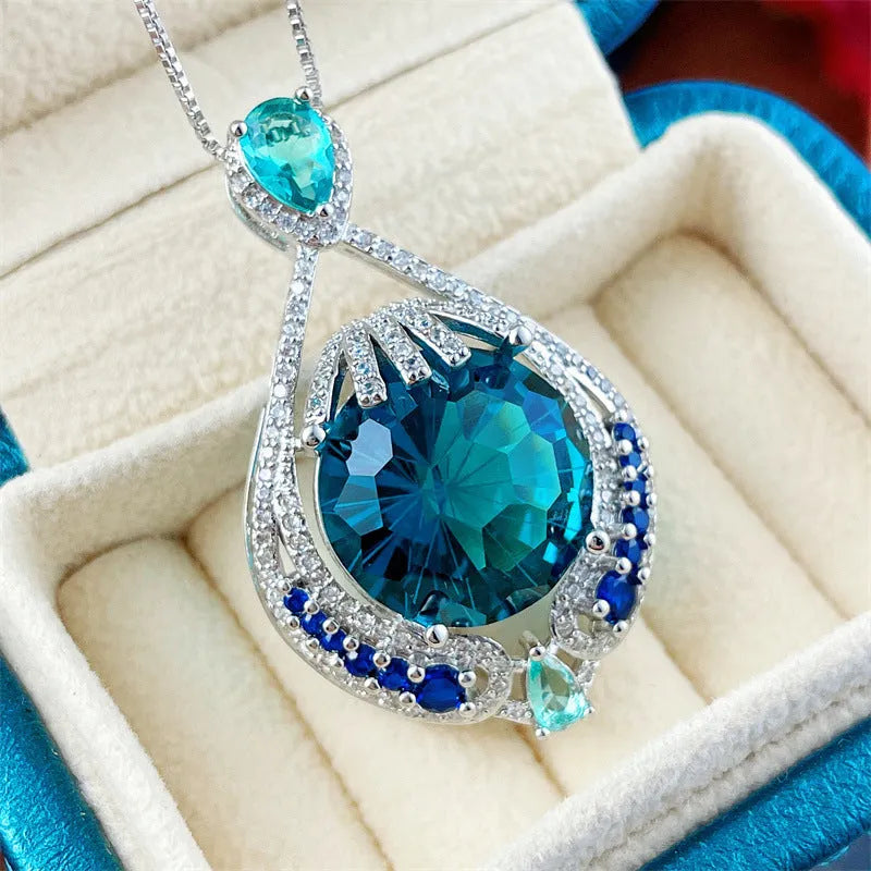 Blue geometric crystal pendant necklace with fireworks cut design on water wave chain