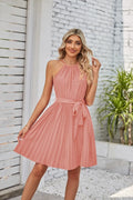 Women's black halter-neck strapless chiffon dress with pleated midi skirt and adjustable waist belt