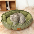 Grey and green reversible donut-shaped pet bed for cats and small dogs, shown in small, medium, and large sizes.