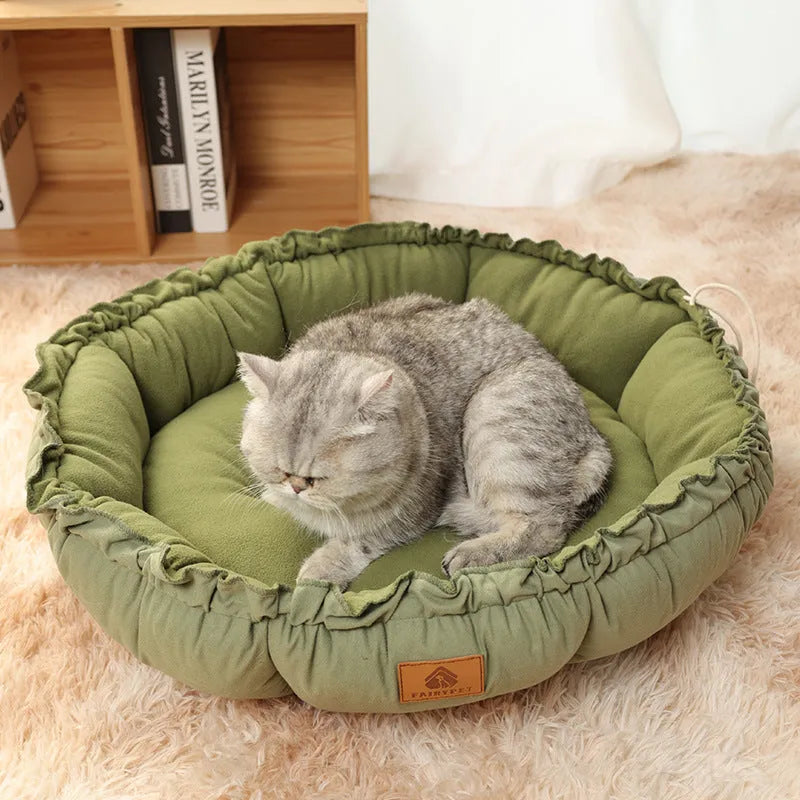 Grey and green reversible donut-shaped pet bed for cats and small dogs, shown in small, medium, and large sizes.