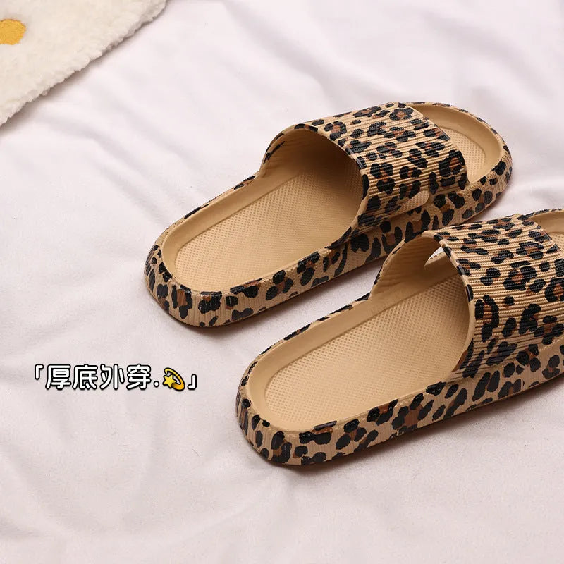Women's leopard print EVA slippers with a thick sole on a plain background.