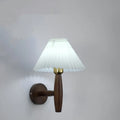 American retro walnut wood wall lamp with fabric shade in bedside setting