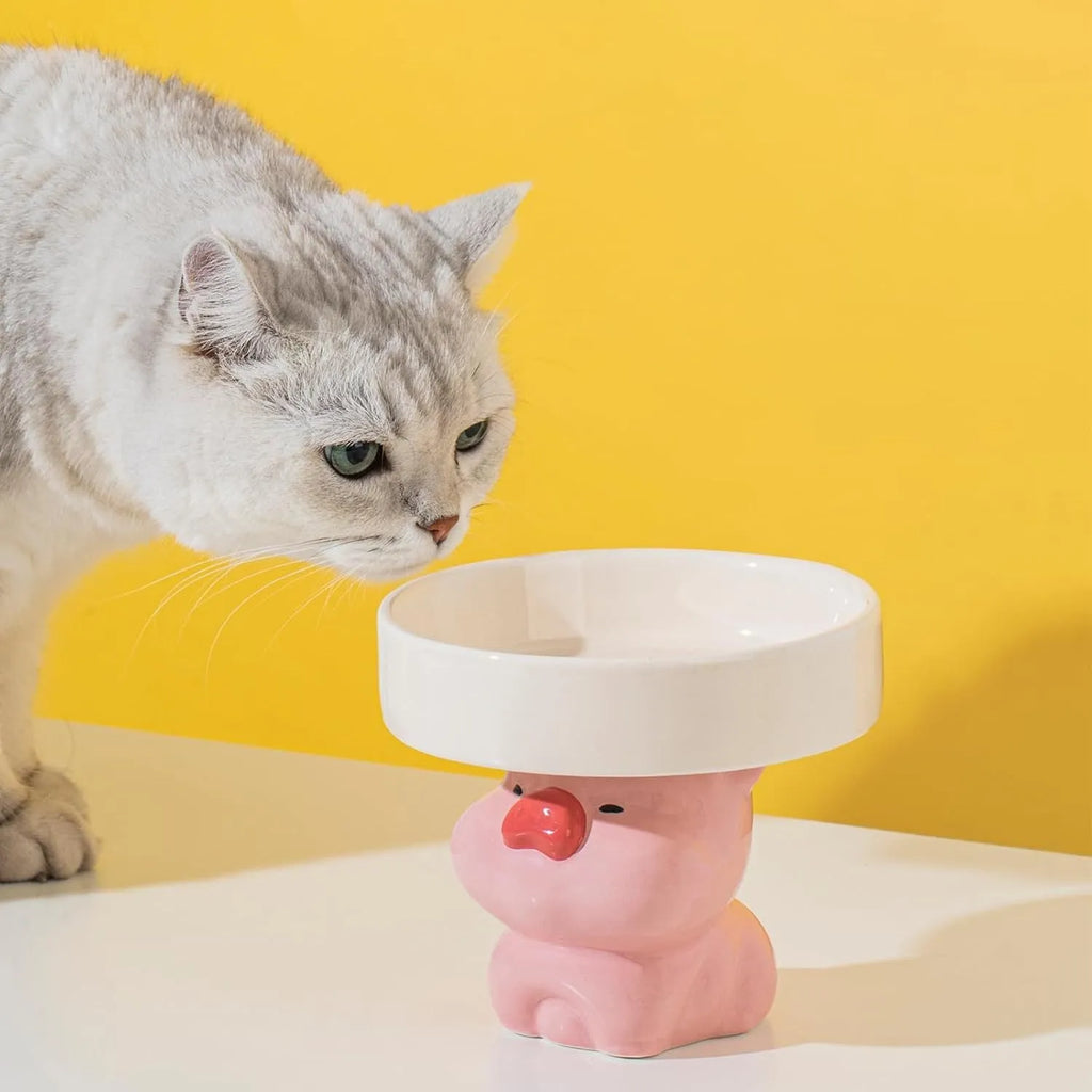 Ceramic raised pet bowl in animal design, showing wide 15cm opening and 4.92-inch elevation.