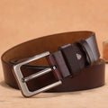 Black casual jeans belt with a square silver alloy pin buckle on a length guide.