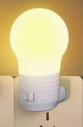 Plug-in bedside baby night light in white, blue or pink with round modern design