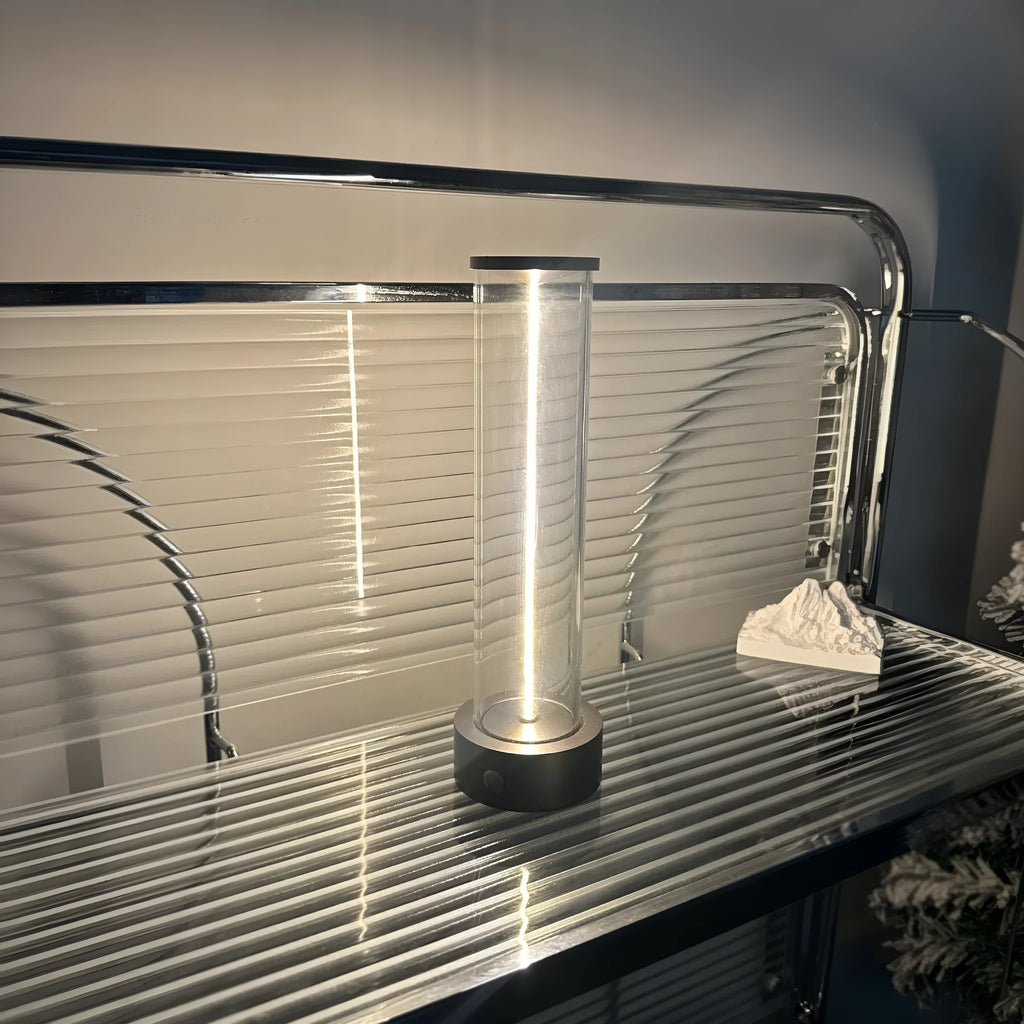 Slender modern LED glass light strip with magnetic back for USB-powered ambient lighting.