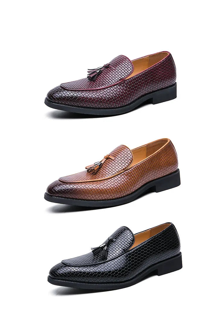Men's black pointed toe slip-on shoes with a tassel detail on the vamp
