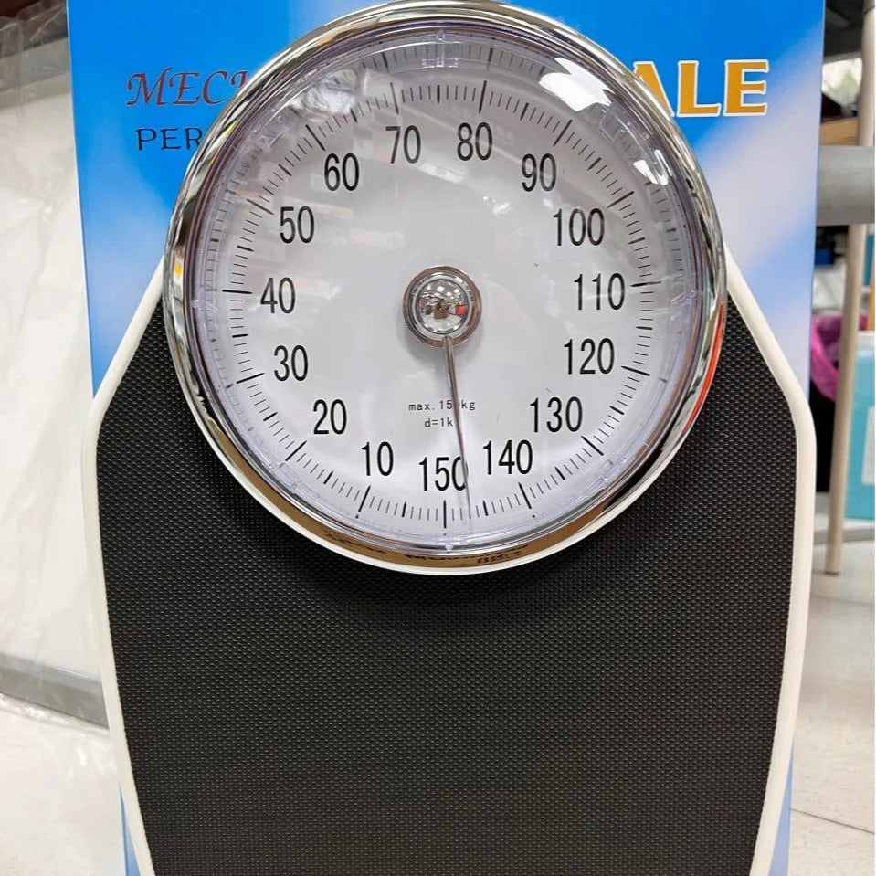 Black mechanical body weight scale with large dial measuring 47x35x11cm