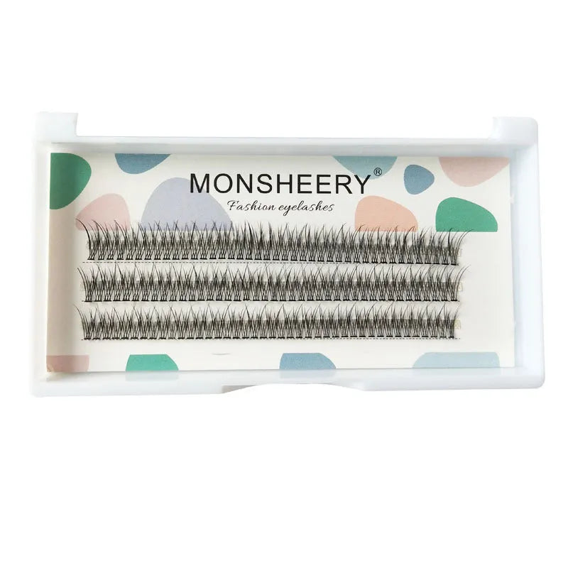 Black V-shaped fairy fishtail false eyelashes with thick segments on a clear background.