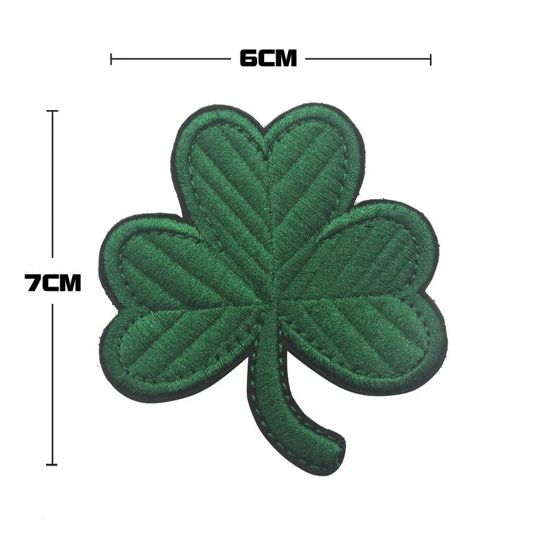 Outdoor embroidered fabric badge with Velcro backing on a tactical vest.