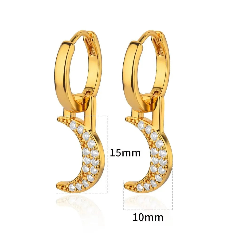 Geometric butterfly-shaped earrings with heart, bow, and star details in copper with a diamond-cut finish.