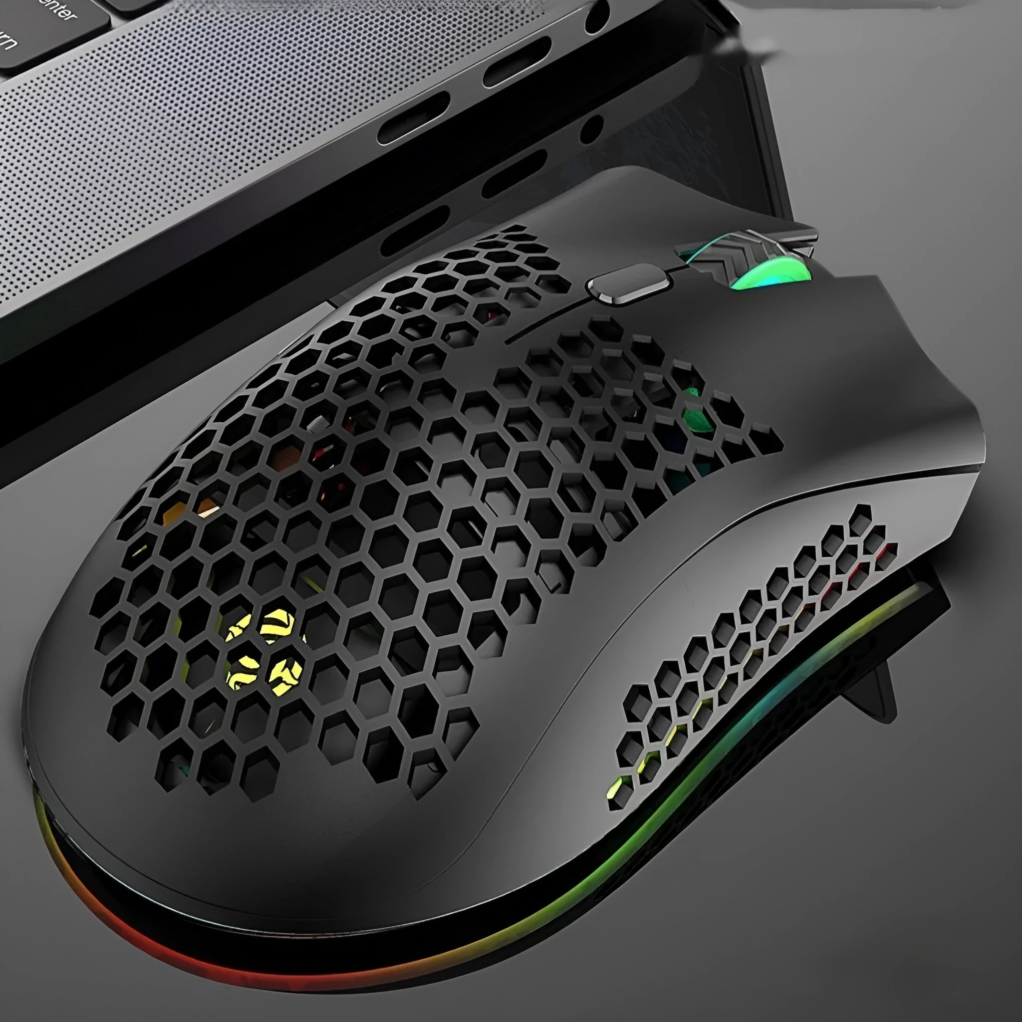 Hollow out wireless gaming mouse with RGB lighting in cyan colour