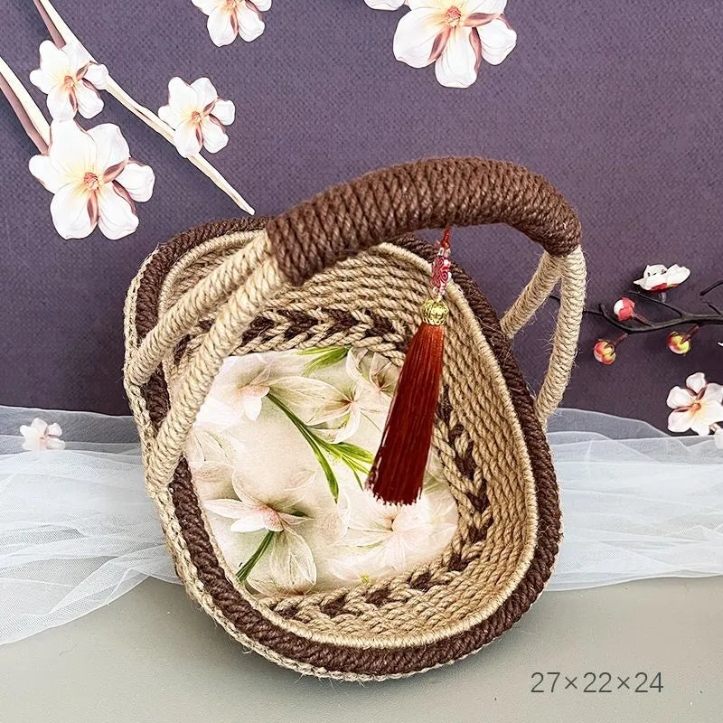 Hand-woven straw basket made from hemp rope, measuring 19cm tall and 12cm wide.