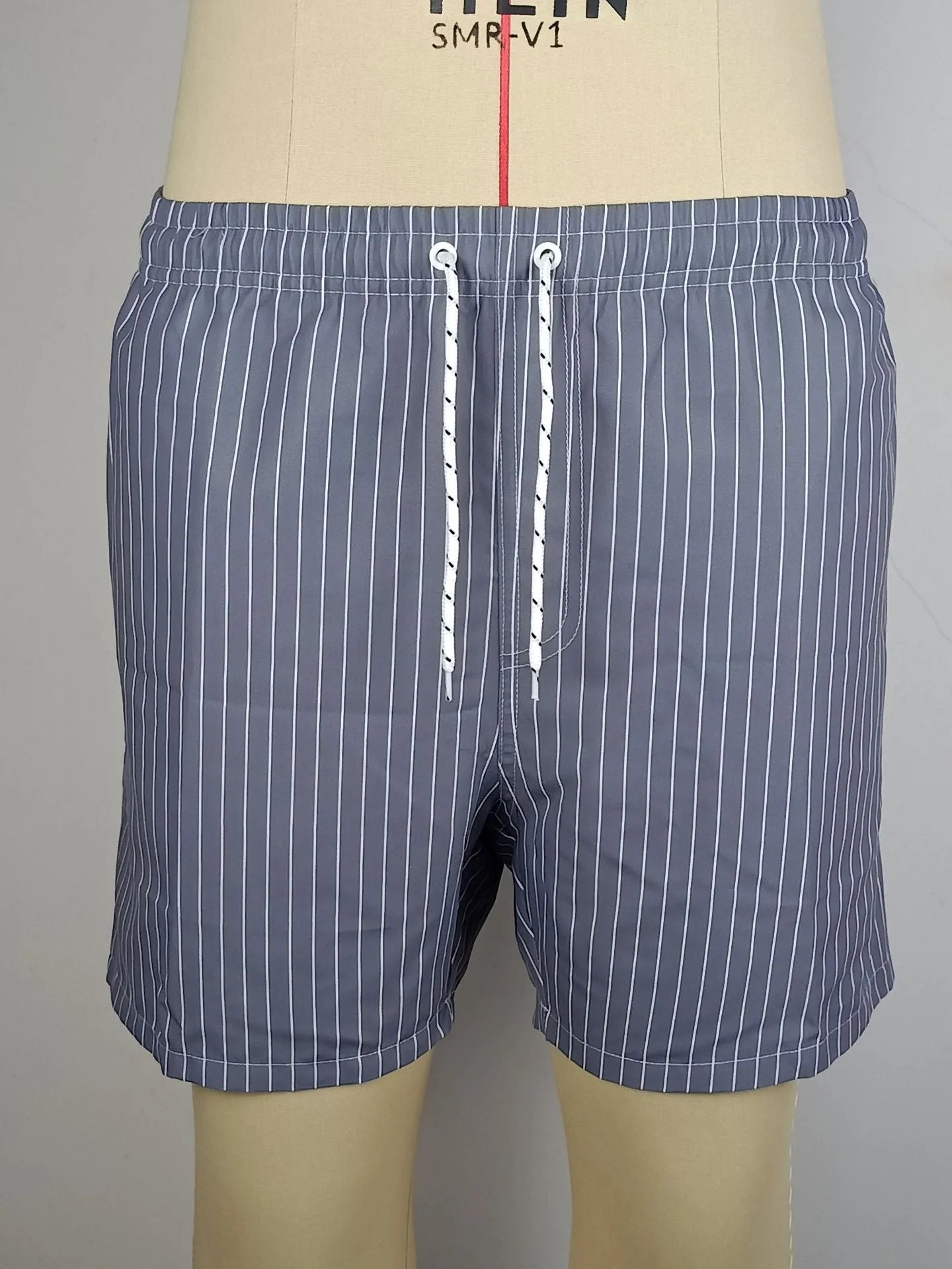 Polyester fibre striped beach shorts in navy blue, grey, khaki, or light blue colours