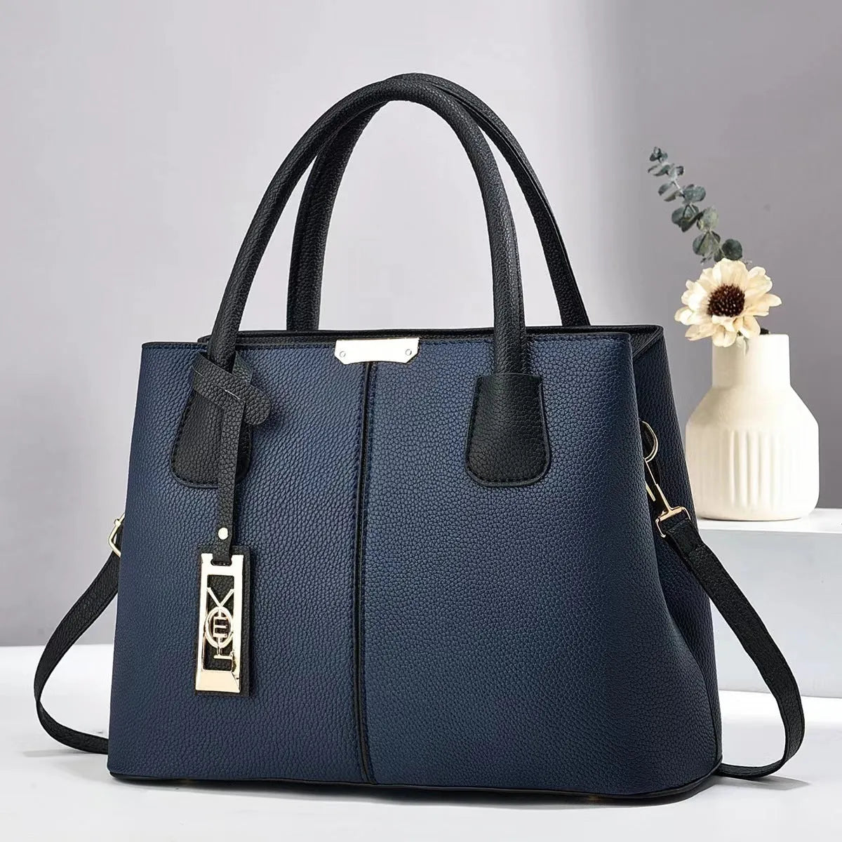 Soft PU women's shoulder bag in horizontal square shape with leather strap, available in multiple colours