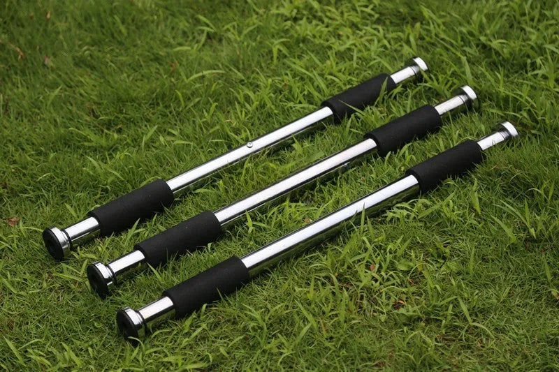 Steel adjustable pull-up bar extended for doorframe installation, showing parallel grips.