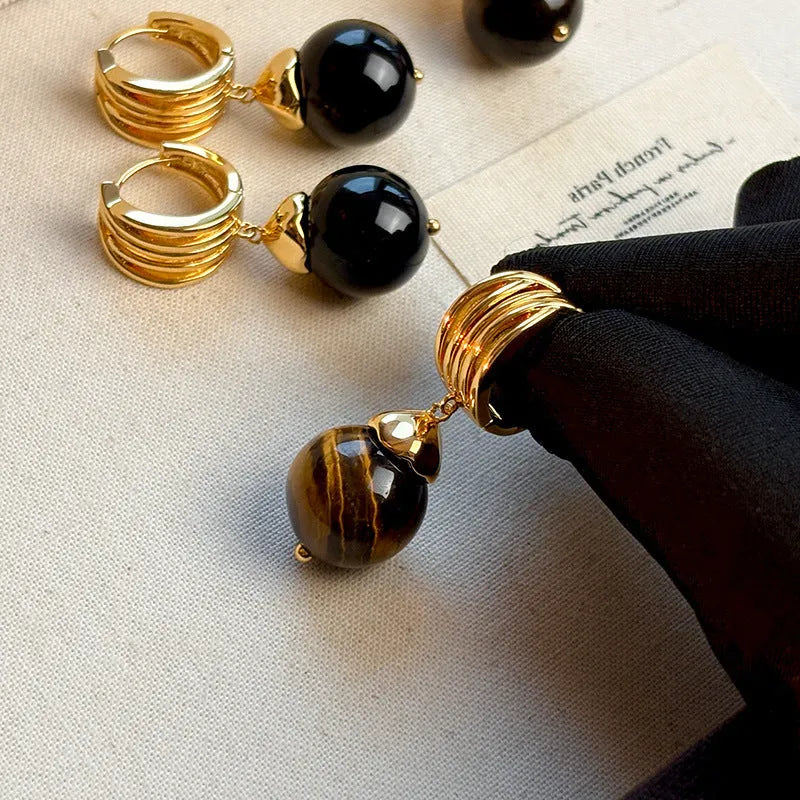 Gold-plated geometric earrings made from brown and black Tigereye stone in a French retro style.
