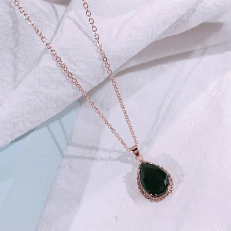 Drop shape geometric pendant necklace with rhinestone inlay in pink rose gold electroplated finish