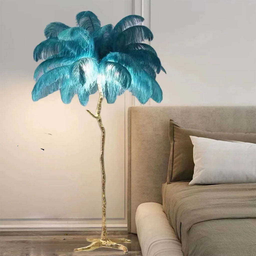 Tall decorative floor lamp with cluster of white resin feathers, standing 170cm high in a living room.