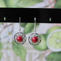 Miao ethnic silver and turquoise earrings with geometric flower disk design and auspicious patterns