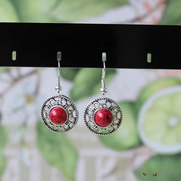 Miao ethnic silver and turquoise earrings with geometric flower disk design and auspicious patterns
