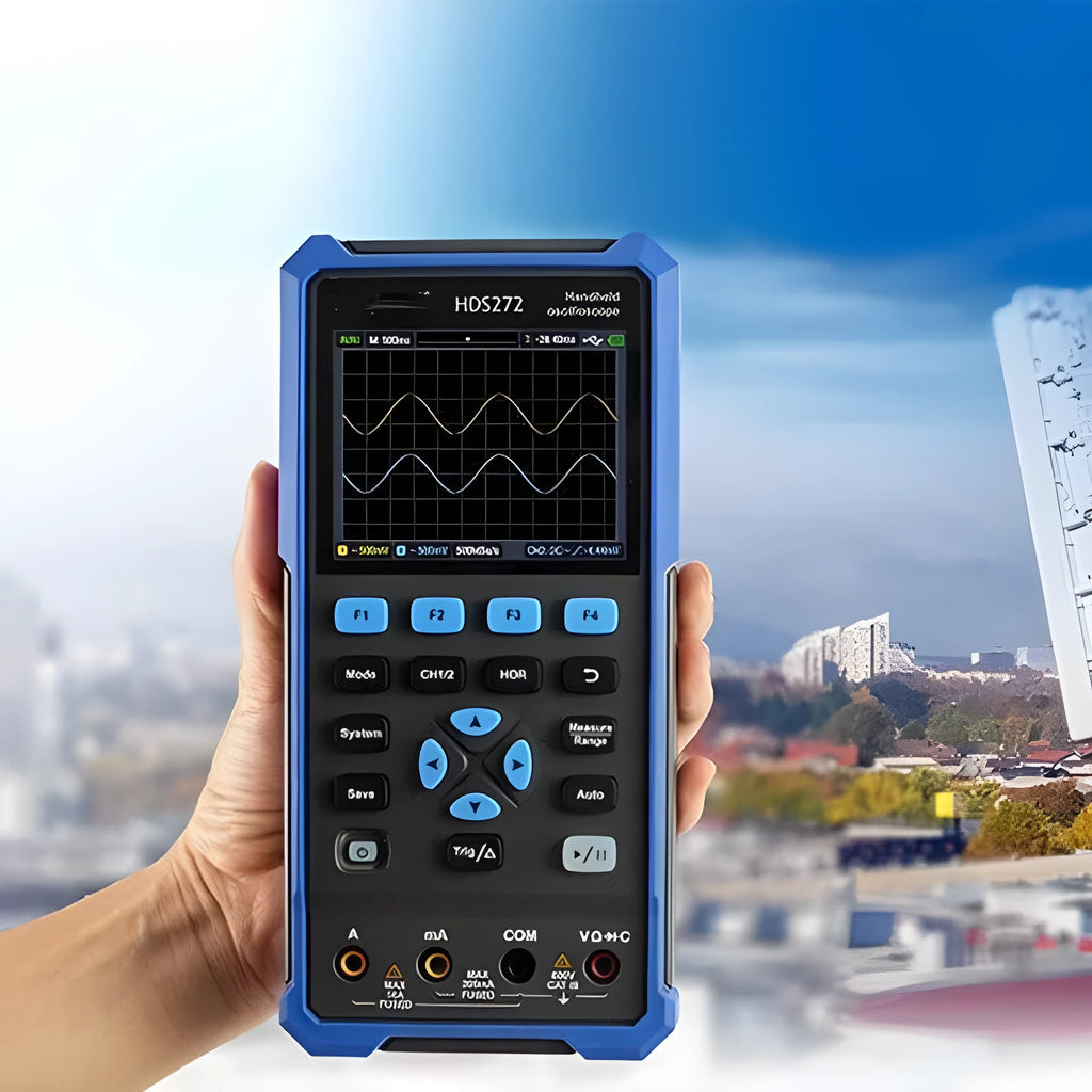 Handheld digital oscilloscope with probe on workbench for automotive electrical testing