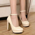 Women's chunky heel high heel shoe in black with a round toe and rubber sole.