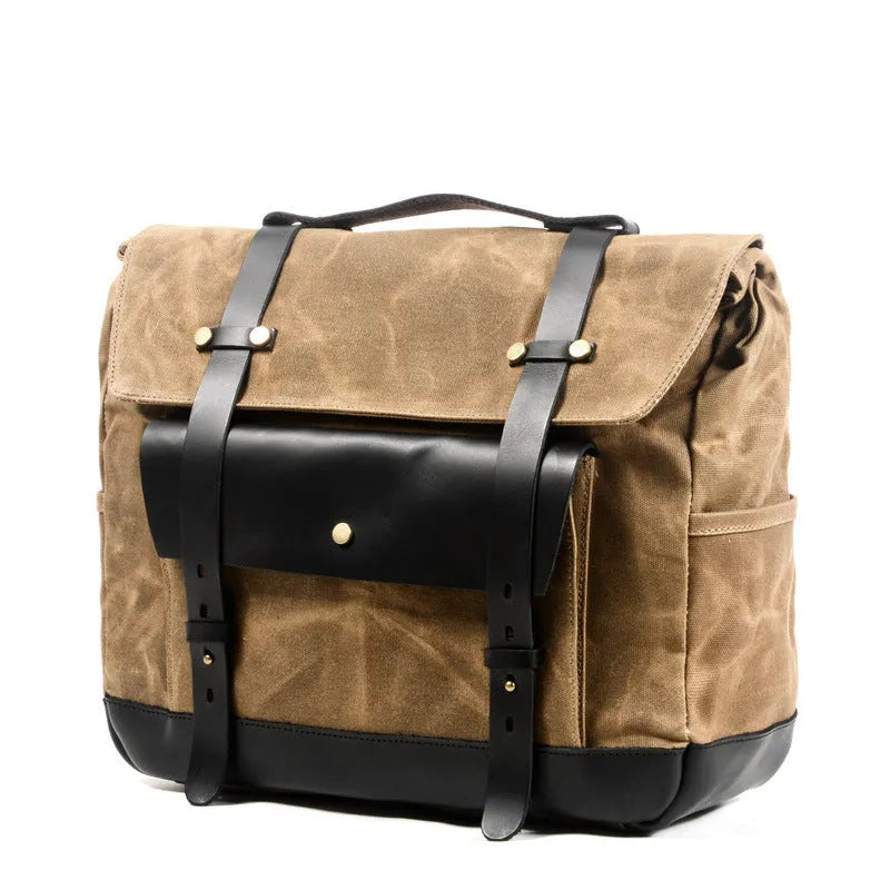 Cotton retro-style messenger bag showing internal organiser pockets and rivet detailing.
