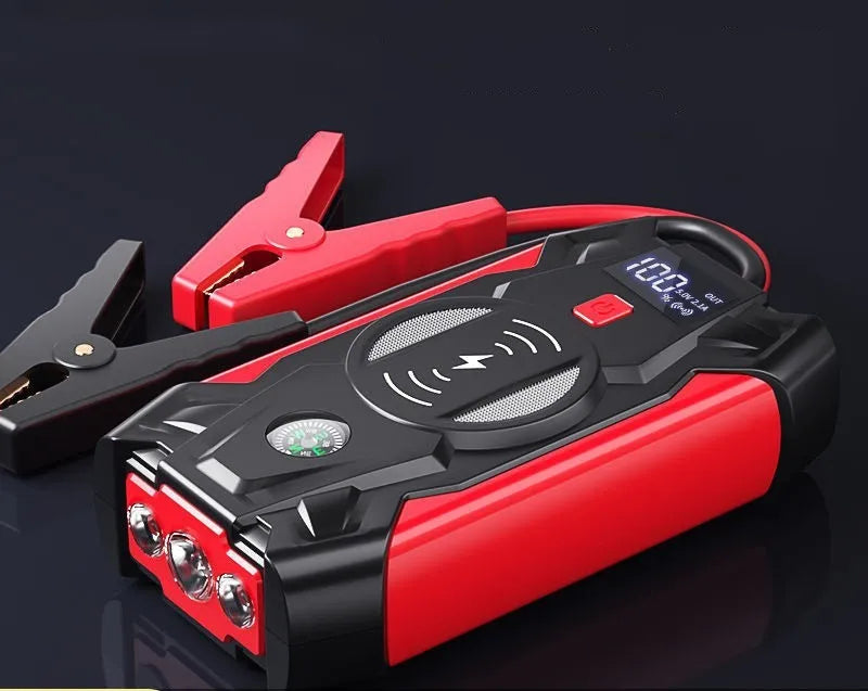 Red car emergency jump starter power bank with digital display and jumper cables