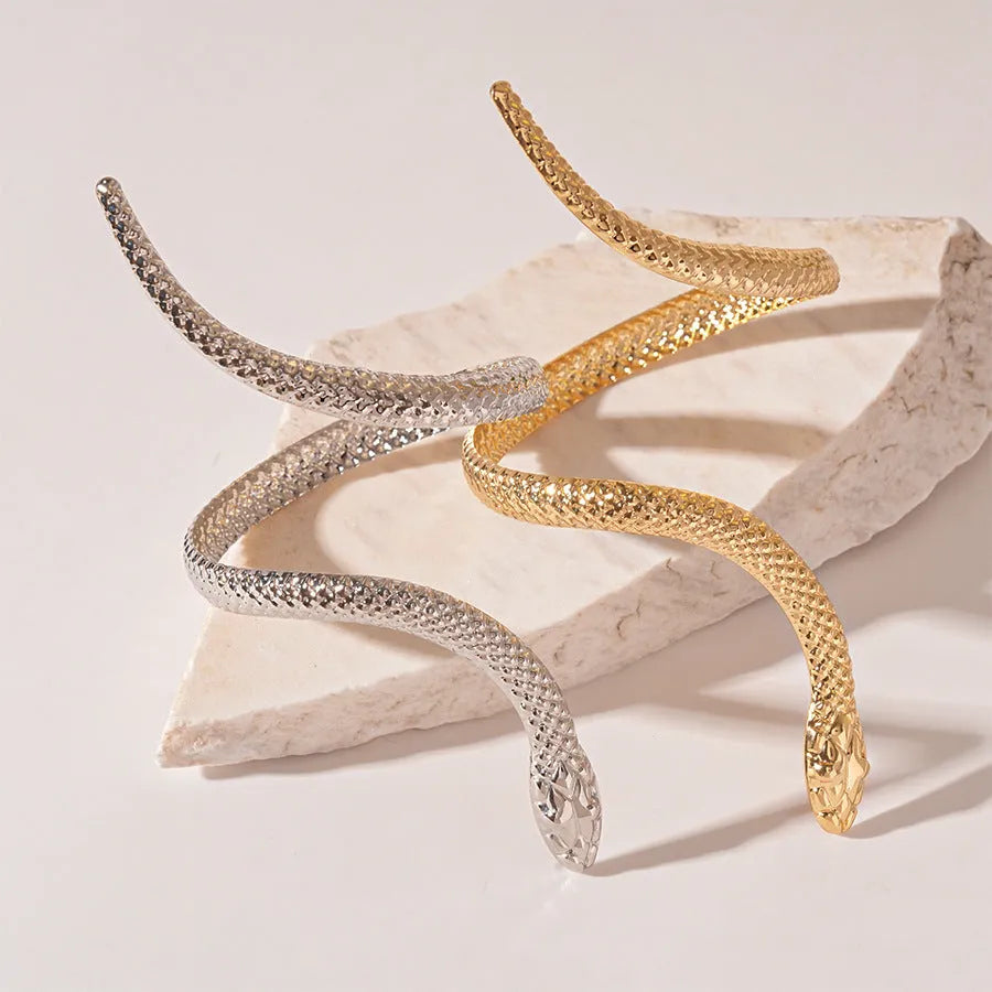 Gold twisted snake design ring and bracelet jewellery set with exaggerated winding metal construction