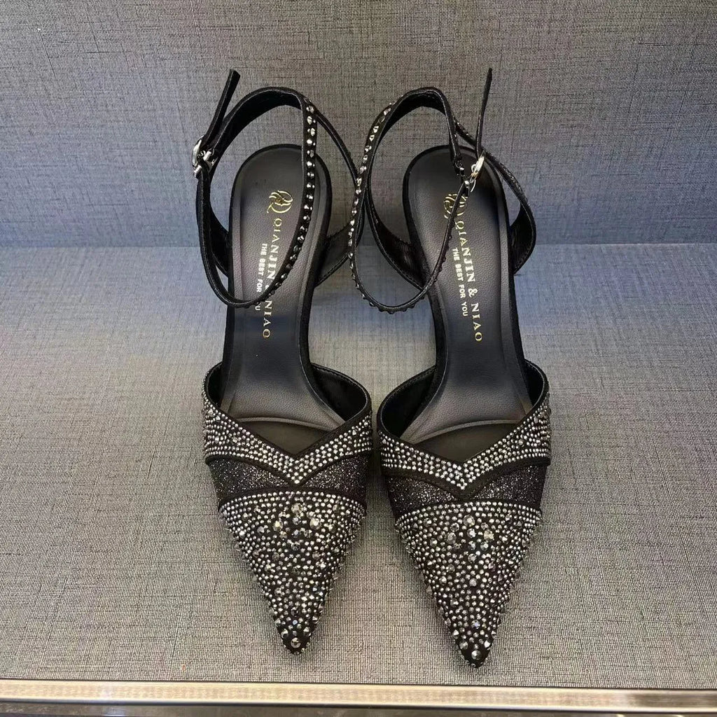 Women's silver and black stiletto heels with red sole and hollow design, pointed toe formal shoes