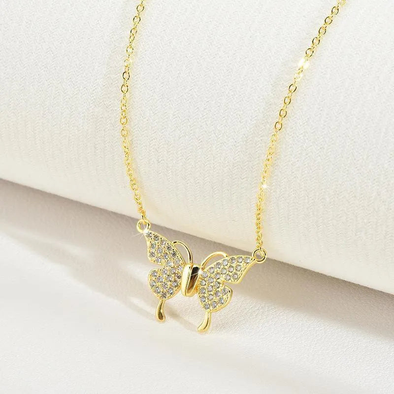 Gold magnetic snap butterfly necklace with twisted titanium steel chain at clavicle length