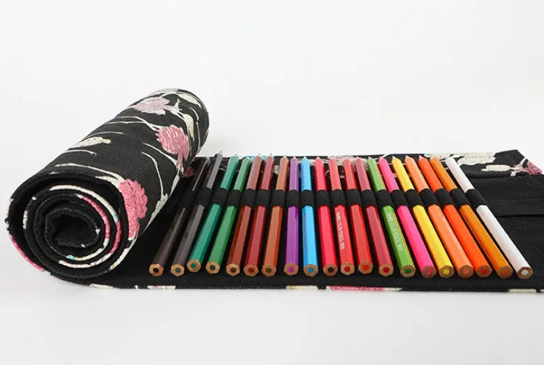 Square canvas pencil case with ballet girl print, showing multiple holes for storing sketching pencils and colour leads.