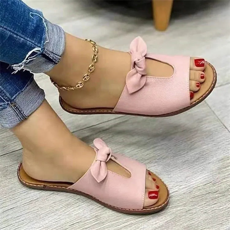 Women's black fish mouth sandals with a bow detail on the artificial PU upper and a rubber sole.
