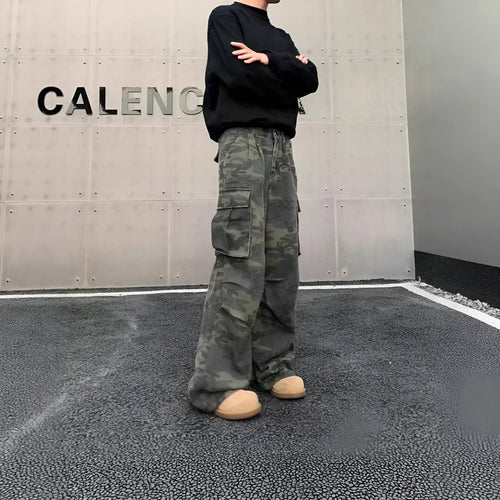 A pair of washed camouflage print cargo pants with multiple pockets on a mid-waist, showing the full trouser length.