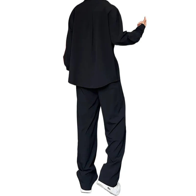 Men's black casual hemp polo shirt and trousers two-piece suit set on a hanger.