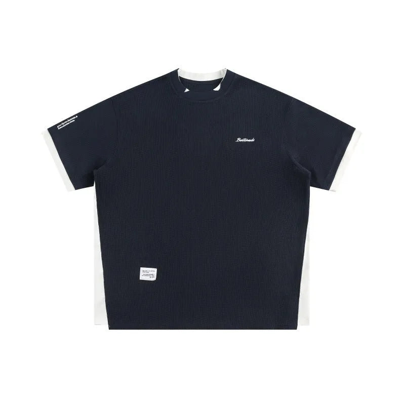 Retro alphabet embroidered loose waffle short-sleeved t-shirt in navy blue, front view.