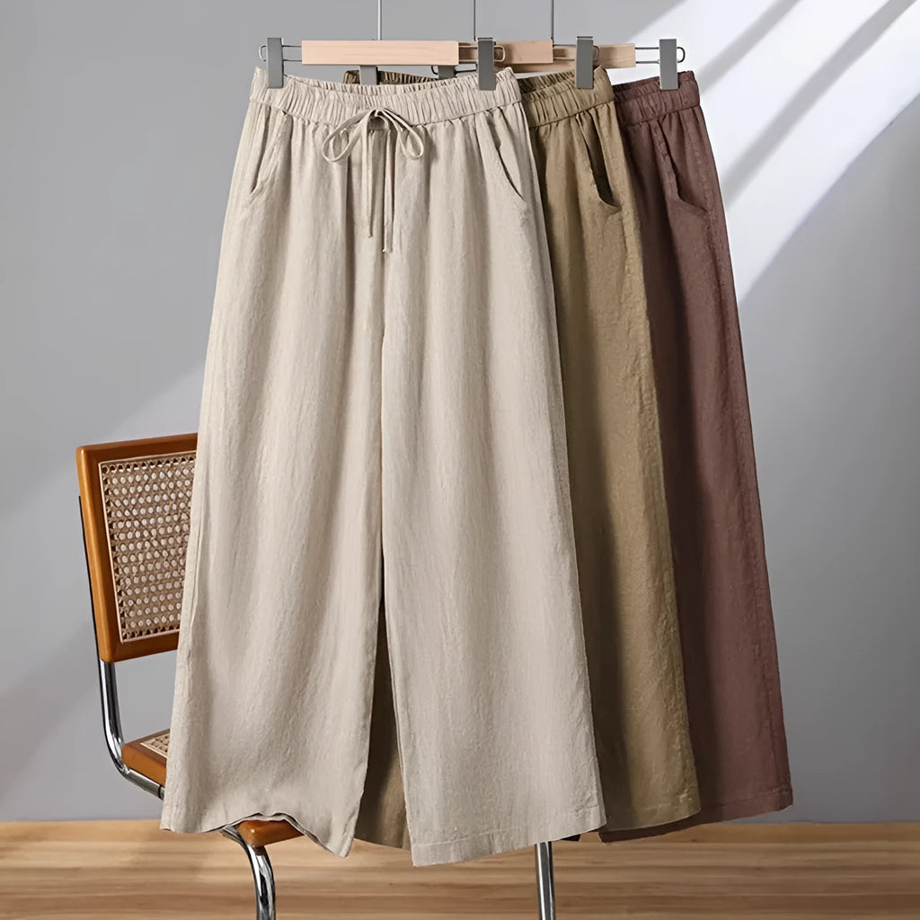 Women's straight leg casual trousers with elastic waist and lace-up drawstring detail in apricot colour.