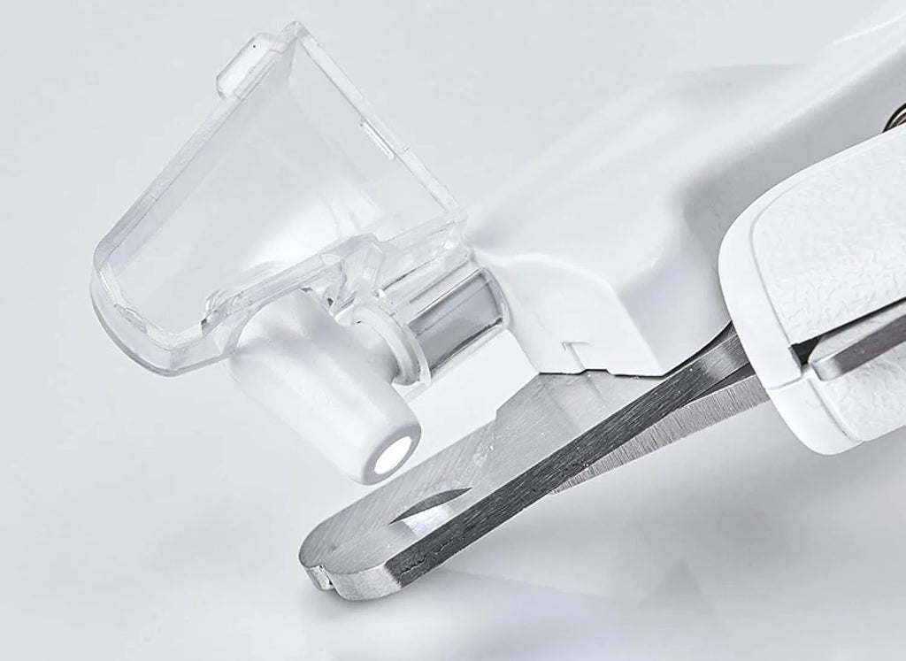 White LED pet nail clippers with open anti-splash guard and nail file on a solid colour background