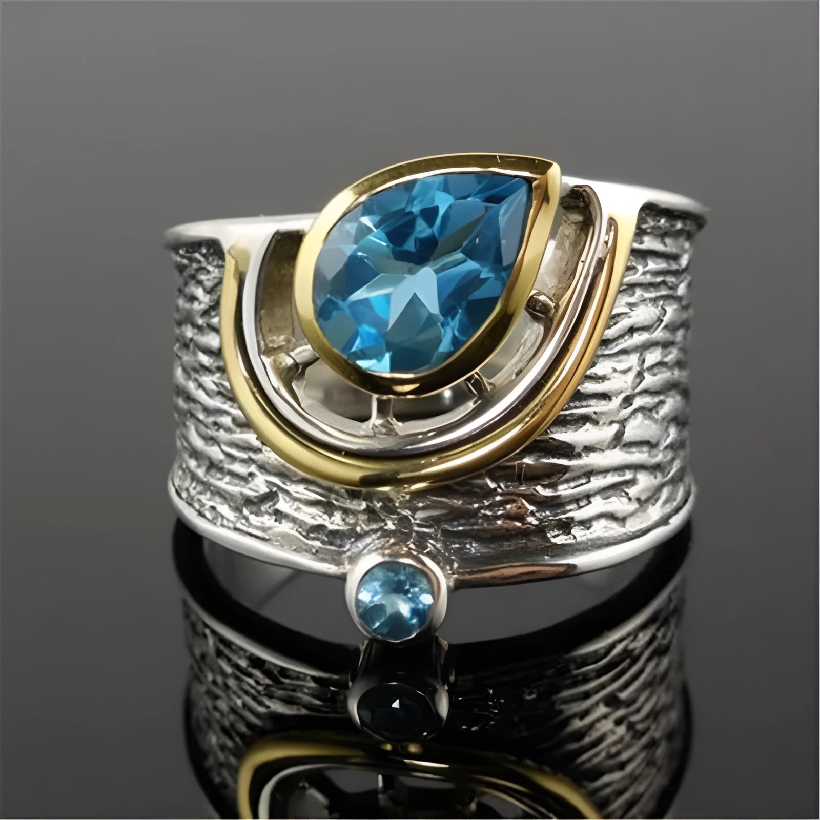 Blue drop-shaped zircon ring with rhinestone inlay on an alloy band, shown in women's sizes 6 to 10.