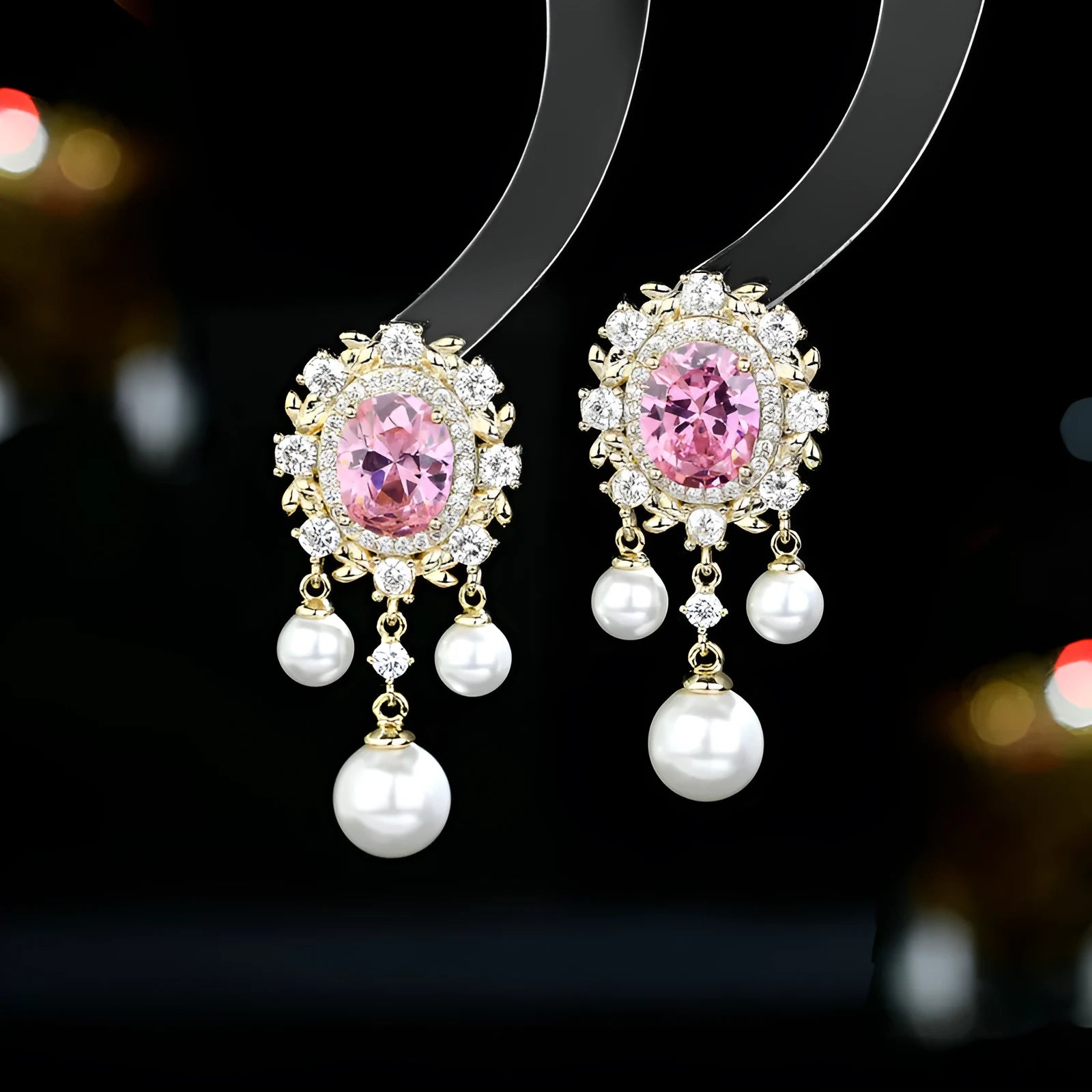 Oval zircon inlaid pearl tassel earrings in copper with geometric design and dangling elements
