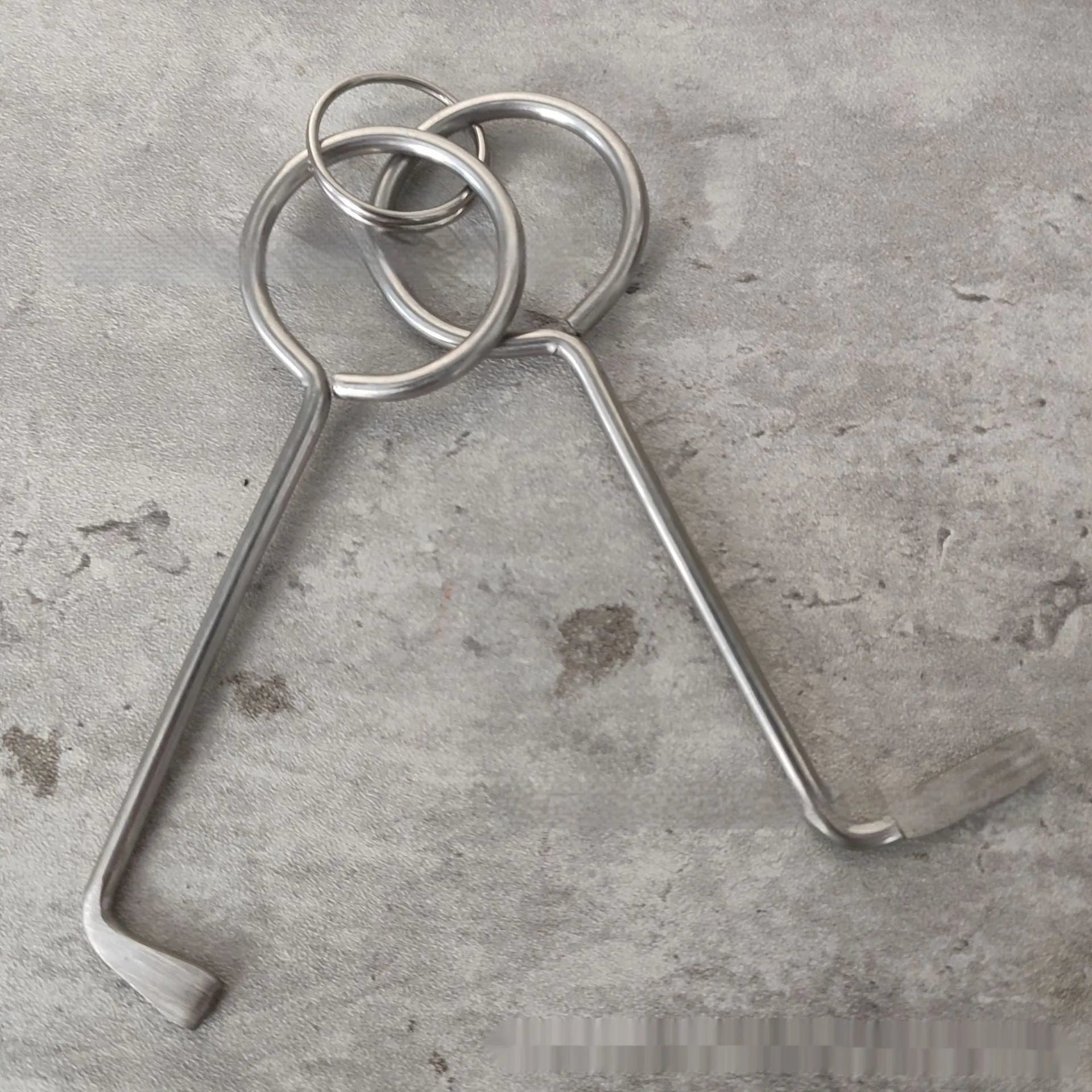Two-piece alloy metal wrench tool set for portable household DIY use.